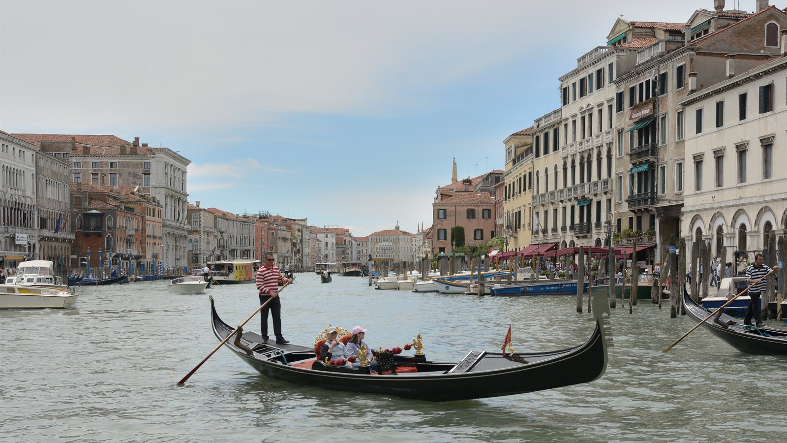 Traditional wooden gondola on a Venetian canal